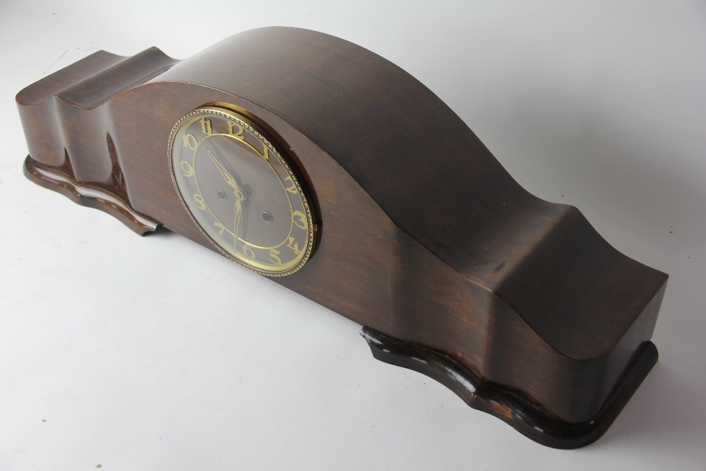 A large 1950's walnut eight day mantel clock, with movement striking on five gongs,