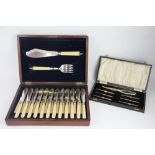 An Edwardian set of twelve pairs of plated fish eaters, and matching servers,