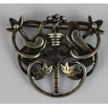 A silver brooch by Ola Gorie, Edinburgh 1987, designed as two birds either side of a flowering tree,