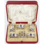 A George V silver five piece silver cruet set, comprising two peppers, mustard,