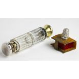 A double ended scent bottle with silver plated mounts and clear glass faceted body,