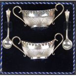 A cased pair of silver two handled salts and Albion pattern salt spoons,