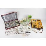 A cased carving set, a collection of French silver plated cutlery, within a fitted case,