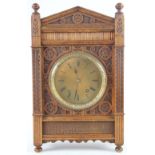 An Aesthetic carved oak eight day bracket clock, late 19th century, faceted glass bezel,