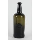 An early 19th century green glass seal bottle,