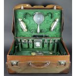 A George V silver and leather Gentleman's travelling case, the tan leather case initialled L.M.