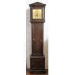 An oak grandmother clock, brass dial with Roman numerals and movement striking on seven gongs,