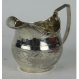 A George III silver cream jug, with bright cut engraved detailing, John Merry, London, 1789, 9cm,