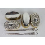 Two pairs of Victorian silver backed dressing table brushes,