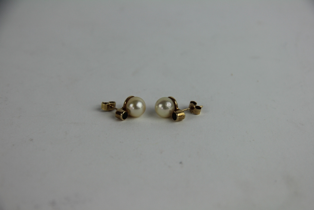 A pair of pearl and emerald stud earrings,