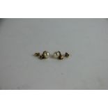 A pair of pearl and emerald stud earrings,