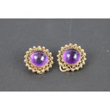 A pair of Zeeta amethyst set clip earrings, designed as a central circular amethyst,