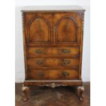 A carved walnut cabinet,