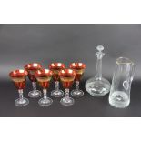 A clear glass globe and shaft decanter and stopper with faceted and diamond cut decoration,