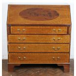 An Edwardian inlaid mahogany bureau, with fall enclosing a fitted interior,