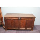 A late 17th century oak coffer, with hinged top and quadruple panelled front, on stile feet,