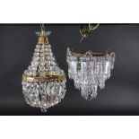 A cut glass drop three tier light fitting, suspending graduated faceted glass drops, 29 cm wide,