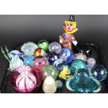 A collection of glass paper weights, to include; millefiore examples and Caithness,