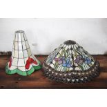 A pair of Tiffany & Co style stained glass lamp shades, decorated with flowers and glass cabochons,