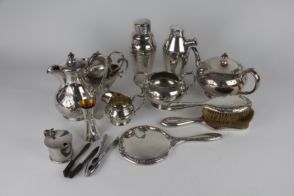 Two silver backed dressing table brushes and a hand mirror along with a collection of silver plated