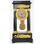 A 19th century French ormolu mounted ebonised portico time piece,