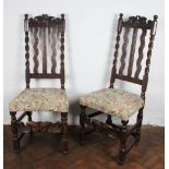 A pair of late 17th century oak chairs,