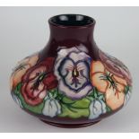 A Moorcroft Pansy pattern vase circa 1993, the squat globular vase,