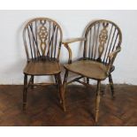 A set of four beech and ash wheel back kitchen chairs, with hoop backs and solid seats,