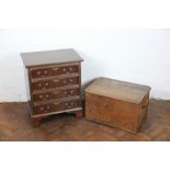 A mahogany small chest, on four graduated long drawers, on bracket feet,