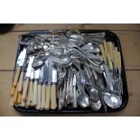 A tray containing a quantity of cutlery and flat ware and a tray containing a collection of silver