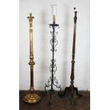 A carved and gilt wood standard lamp, with spiral column, on circular base,