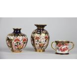 Three Royal Crown Derby minatures, to include; a tyg, 1904, 4cm high, an ovoid vase, 8.