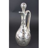 An Art Nouveau silver overlaid clear glass claret jug and stopper, with vacant cartouche,