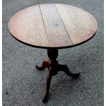 A George III oak tripod table, with turned column on tripod base, 75.5cm H x 76.