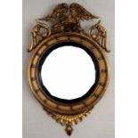 A Regency carved gilt wood concave wall mirror,