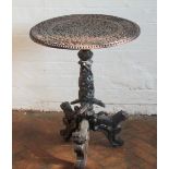 A late 19th Century Anglo-Indian carved hardwood occasional table, the top decorated with leaves,