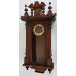 A beech and walnut Vienna regulator, eagle surmount, with Roman numeral chapter ring,