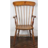 A 19th Century beech and ash country kitchen chair, with spindle back and solid seat,