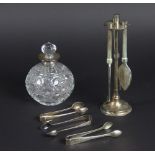 A silver collared cut glass spherical scent bottle and associated stopper,