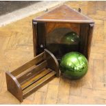 A stained pine hanging corner cabinet, with glazed door,