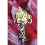 A 9ct yellow gold and semi precious stone set necklace, designed as a gold chain,