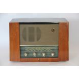 A Bush bakelite radio, no DAC 9OA, another Bush radio with circular dial, DAC70 and a PYE Radio,