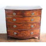 An early 19th Century mahogany bow front chest, of two short and three graduated long drawers,