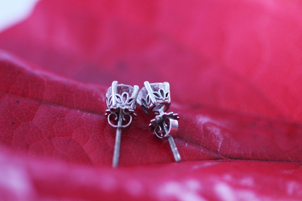 A pair of diamond solitaire stud earrings, - Image 4 of 4