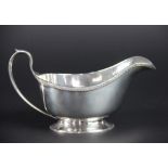 A silver sauce boat Elkington & Co, Birmingham 1936, of low oval form,