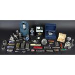 A collection of nickel plate cigarette cases with a pair of plated condiments,