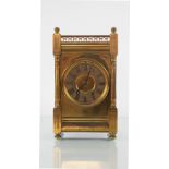 A late 19th Century gilt brass mantel clock,