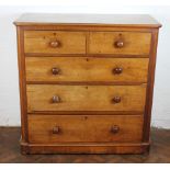 A Victorian mahogany chest, of two short and three long drawers, with bun handles, on plinth base,