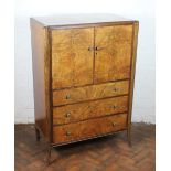 An early 20th Century walnut cabinet by Amos Reynolds Ltd,