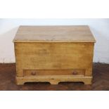 A late 19th Century pine blanket box, with hinged top and base drawer, on plinth base,